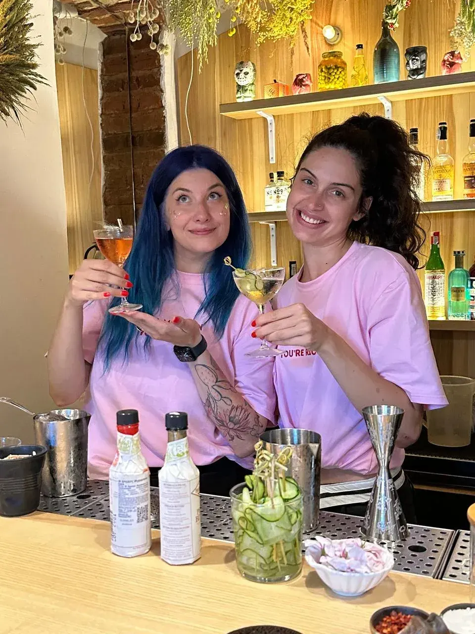 Hot Mamas co-founders Natalka and Dana making cocktails.