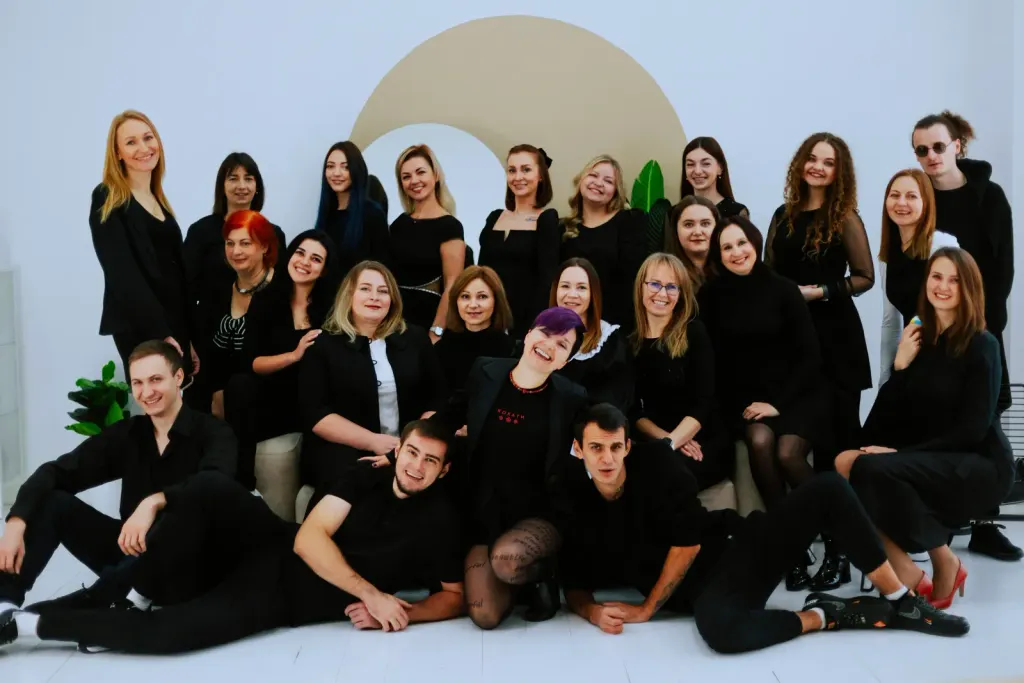 ThinkGlobal school teachers and staff team together with Yana Moskovchenko during a group photoshoot.